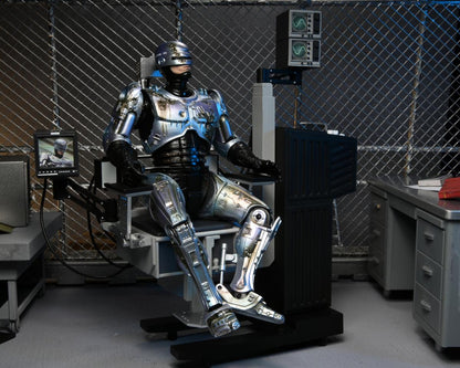 RoboCop – Official Ultimate Battle-Damaged RoboCop with Chair Figure
